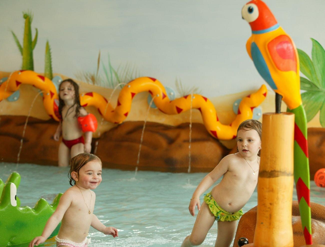 Babies and toddlers in the Alphotel's indoor pool